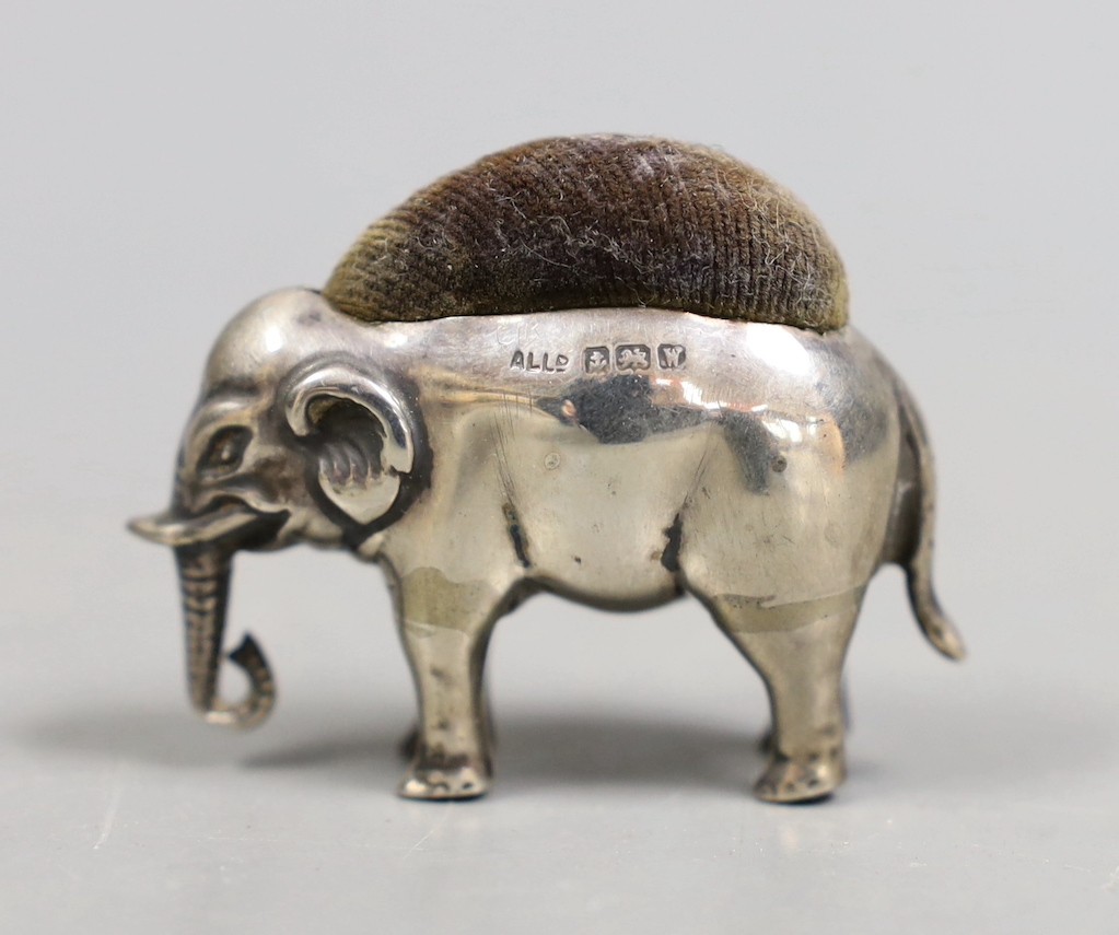 A George V novelty silver pin cushion, modelled as an elephant, Adie & Lovekin Ltd, Birmingham, 1921, length 45mm.